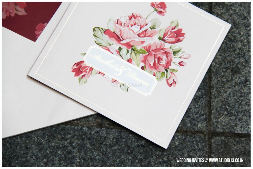 Photo of white and floral wedding card