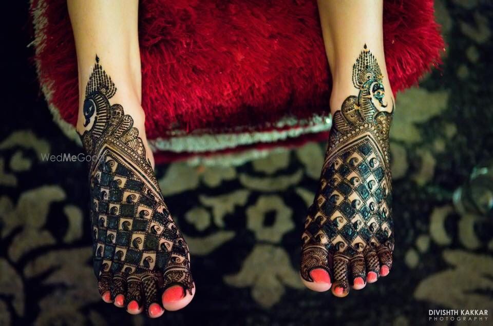 Photo of Unique peacock theme bridal mehendi design on feet