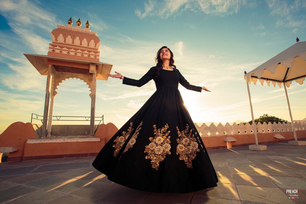 Photo of Elegant black and gold gown for pre wedding shoot