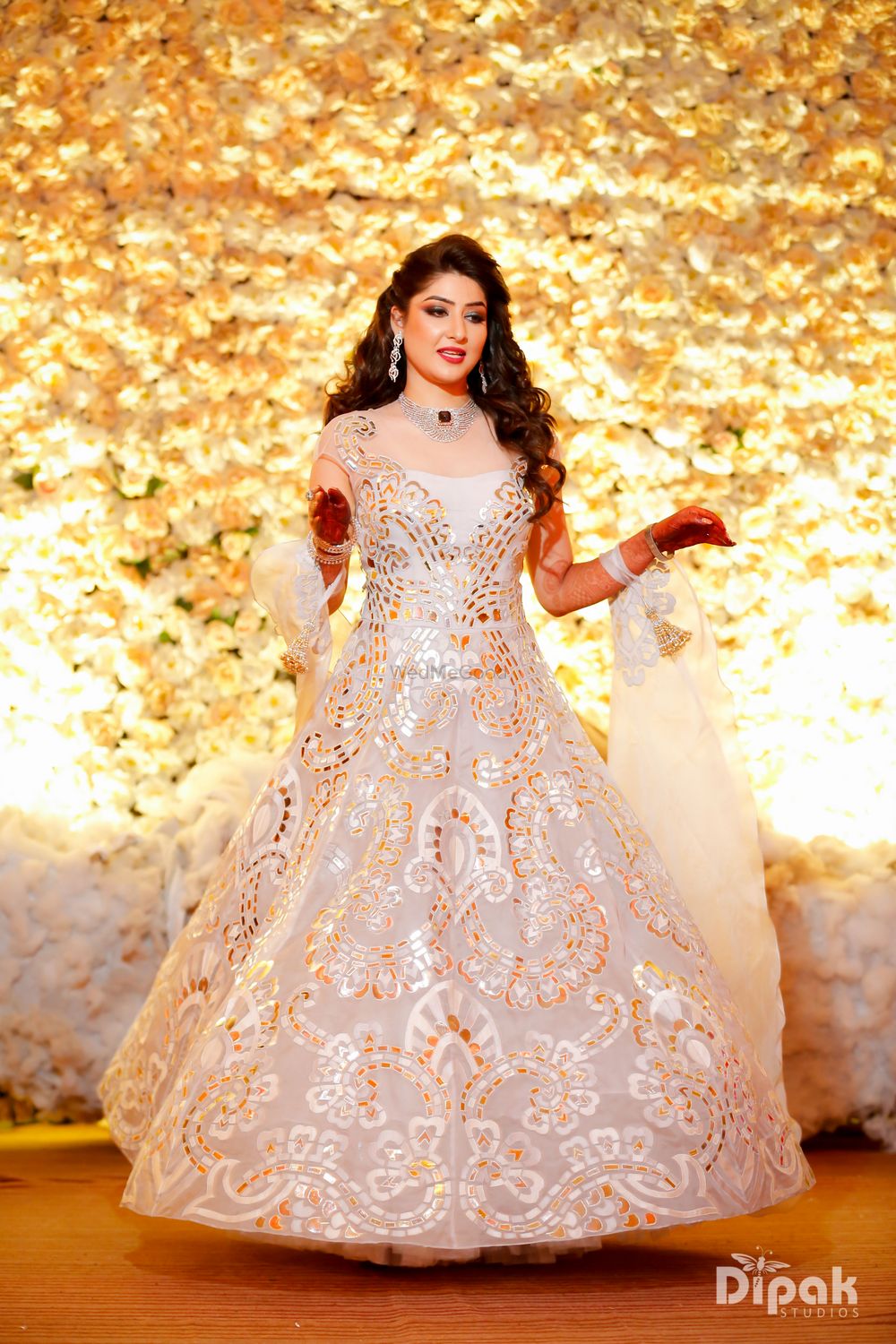 Photo of White and gold cocktail dress for sangeet