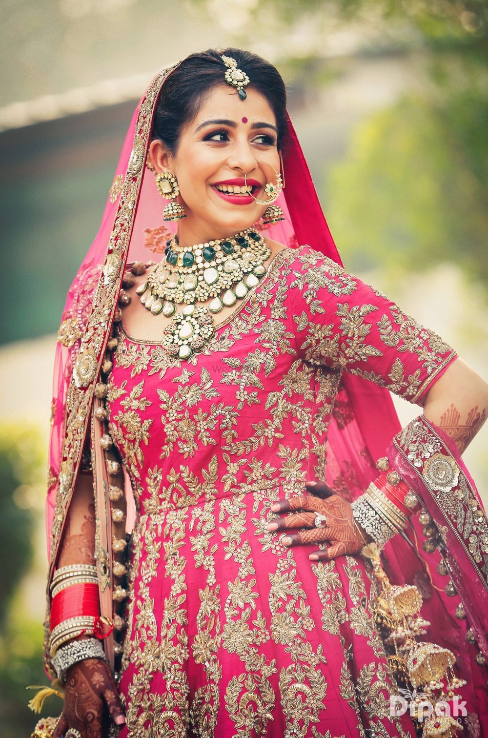Photo of Contrasting bridal jewellery with pink anarkali on sikh bride
