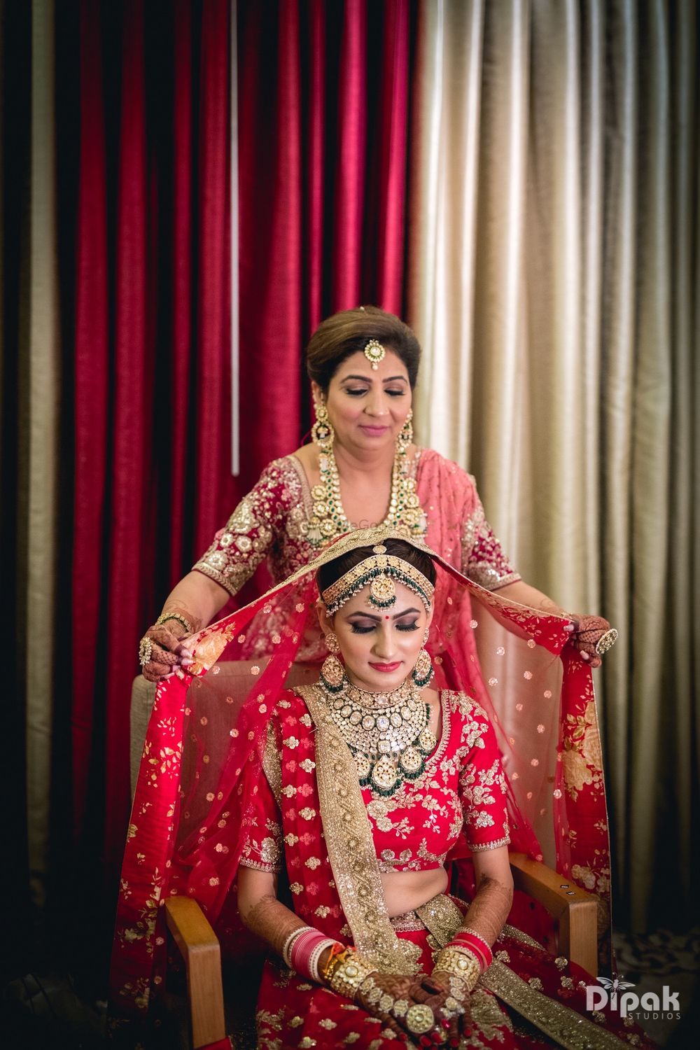 Photo of Mom placing dupatta on brides head