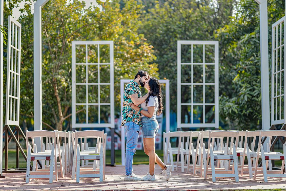 Photo of pre wedding shoot with couple kissing shot