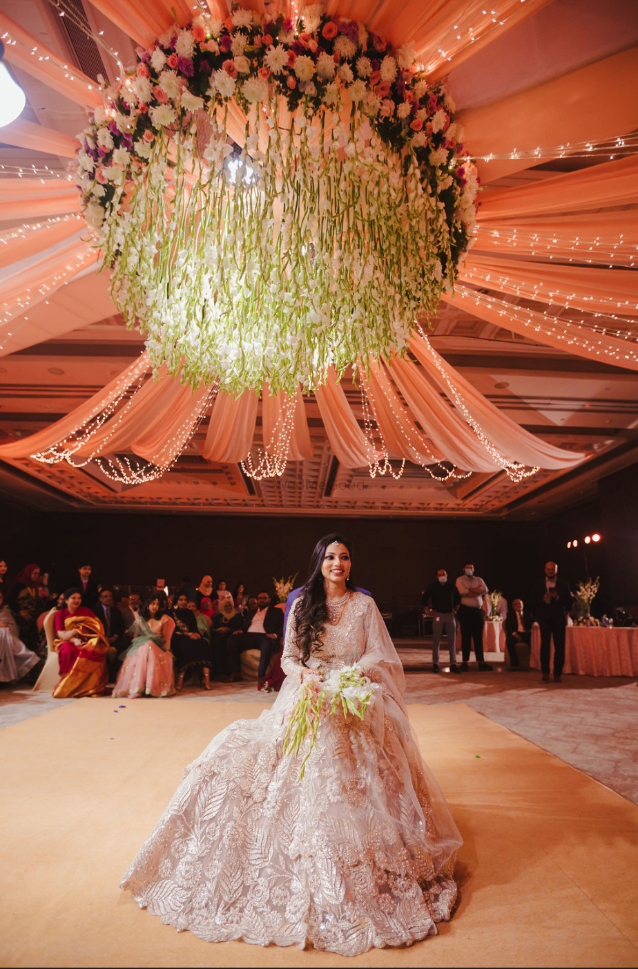 Photo of Bride dressed in an ivory applique work lehenga.