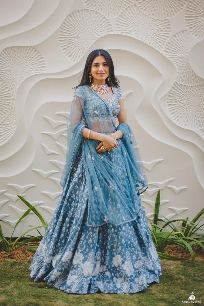 Photo of Bride dressed in a periwinkle blue lehenga.