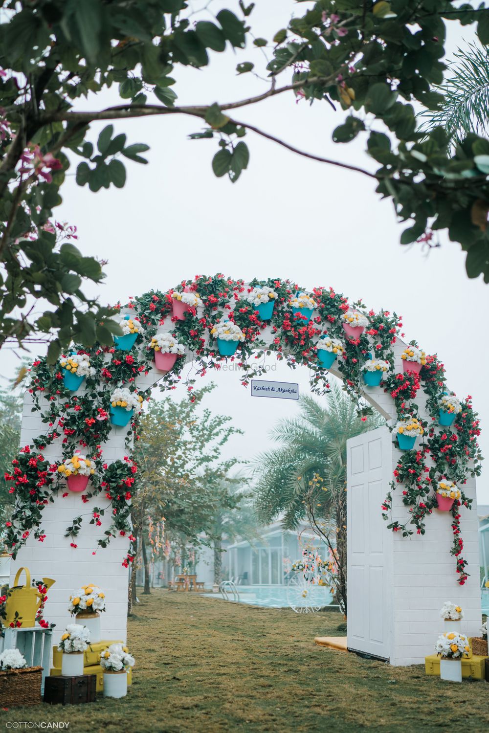 Photo of Archway entrance decorated with floral vases.