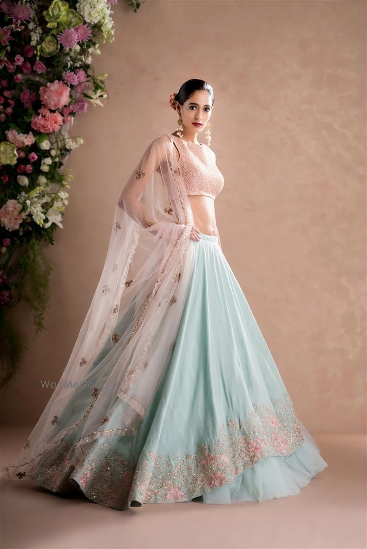 Photo of peach and powder blue lehenga