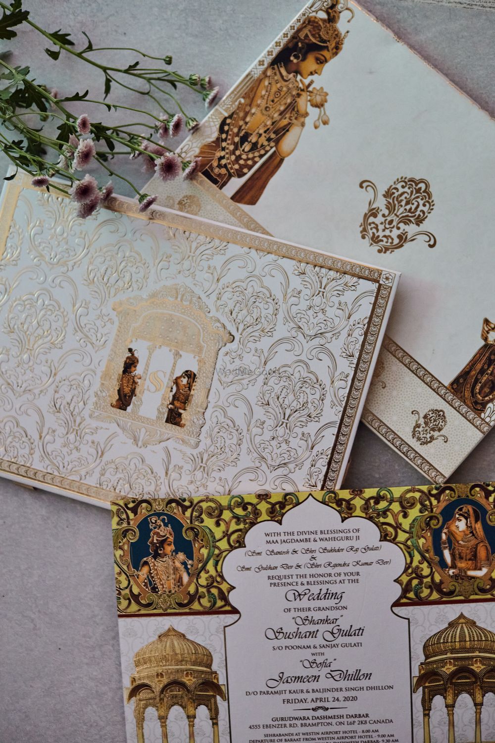 Photo of unique wedding invite for palace wedding with portraits