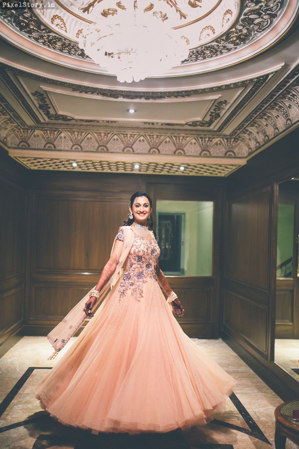 Photo of peach and purple floral motifs cocktail gown