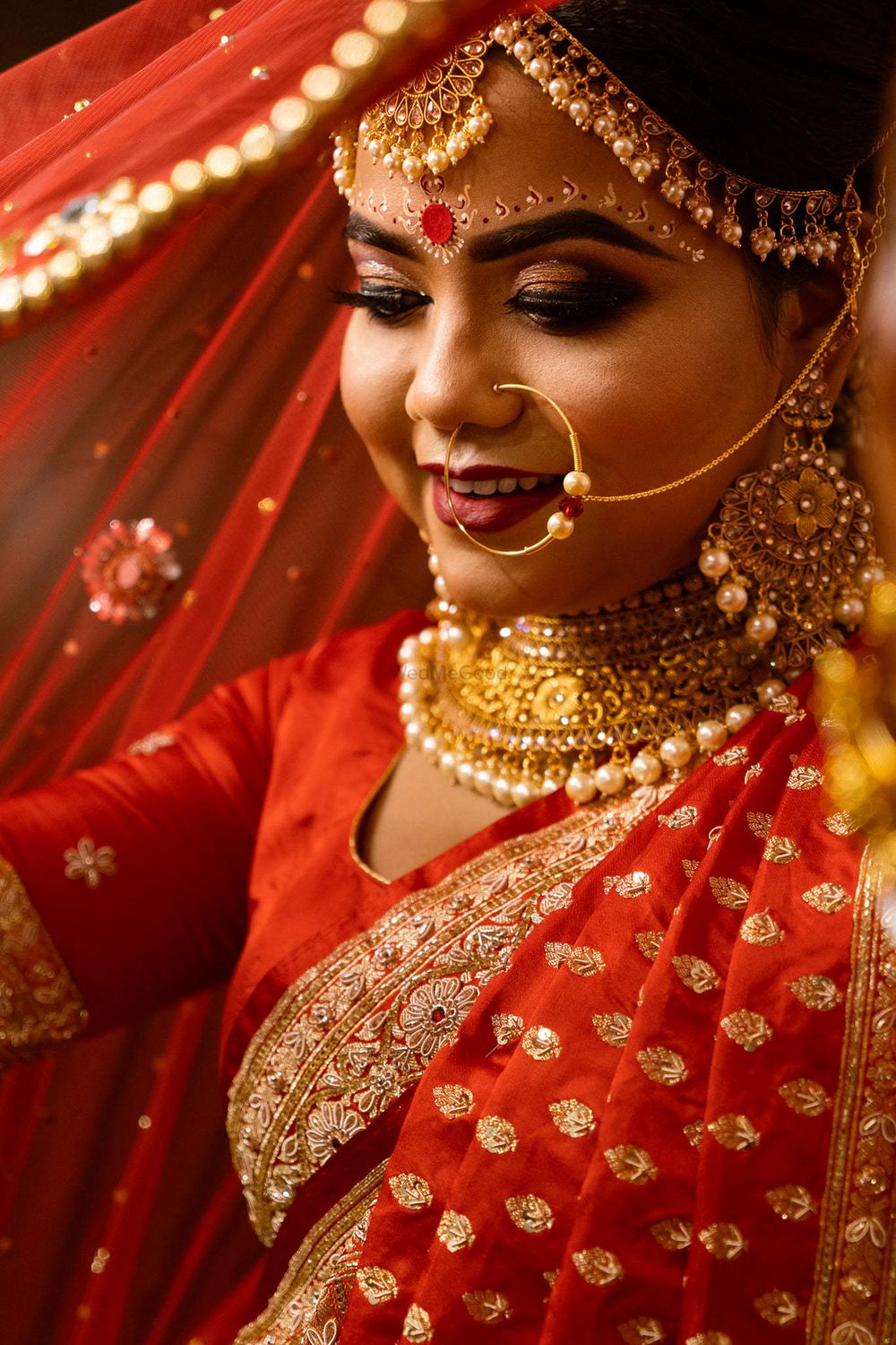 Photo of A closeup shot of a bengali bride