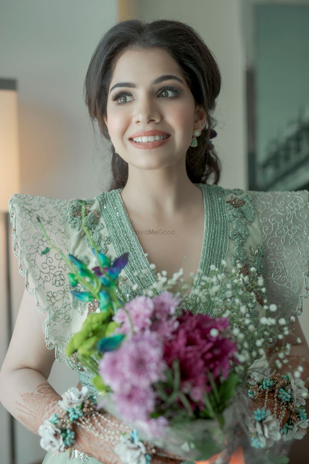 Photo of elegant and subtle bridal engagement look with unique sleeves
