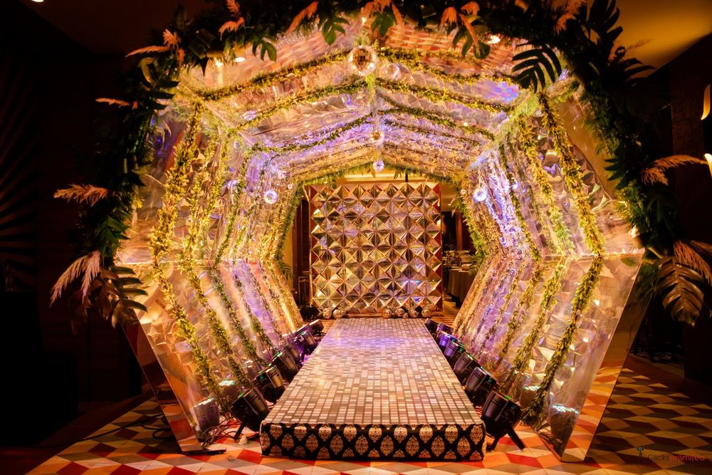 Photo of Grand entrance decor with lights and flowers