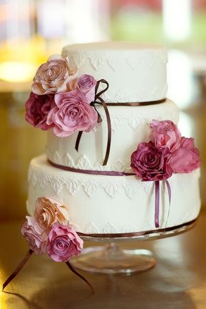 Photo of elegant white and purple cake