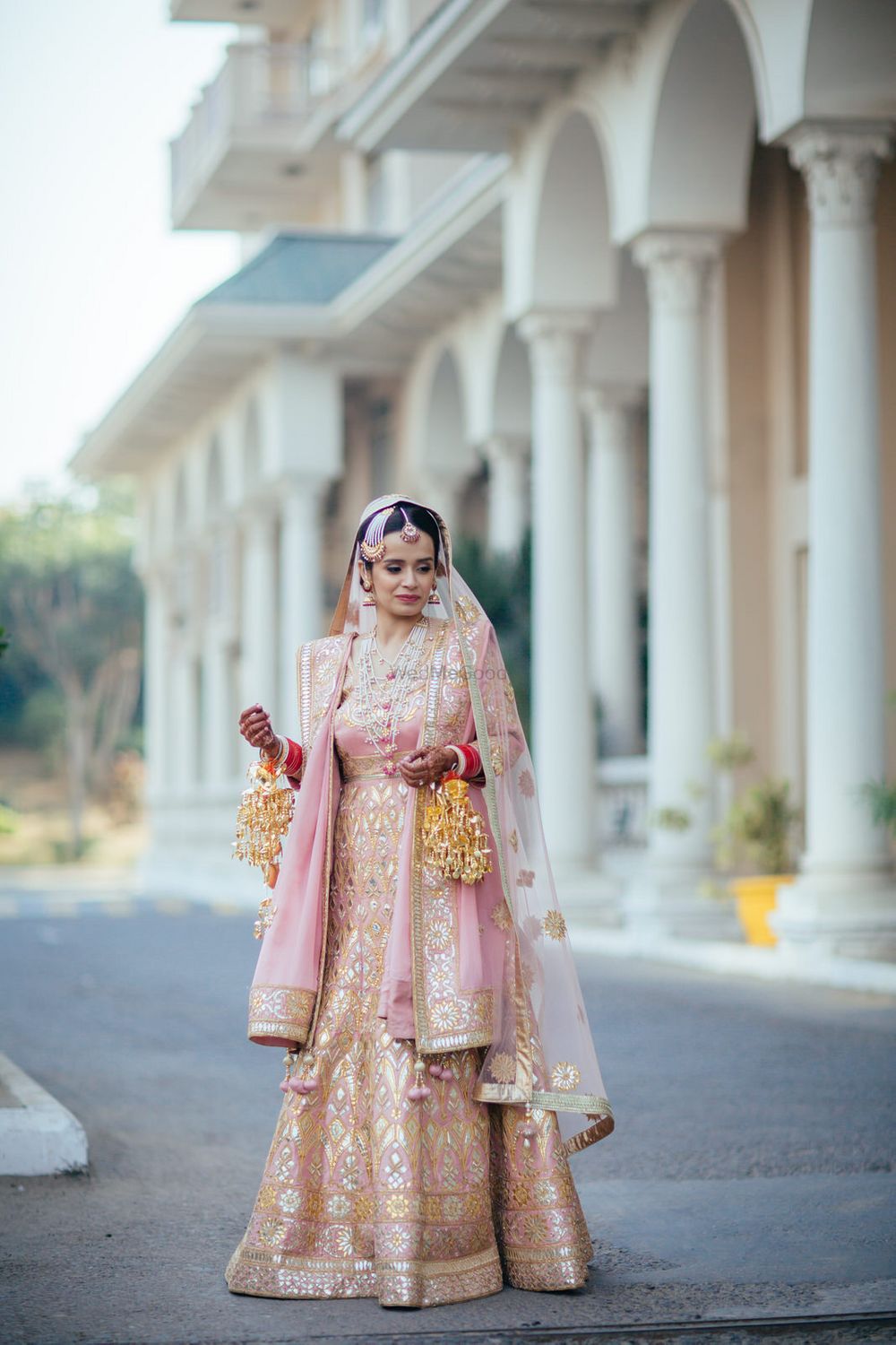 Photo of Peach and gold Sikh bridal anarkali