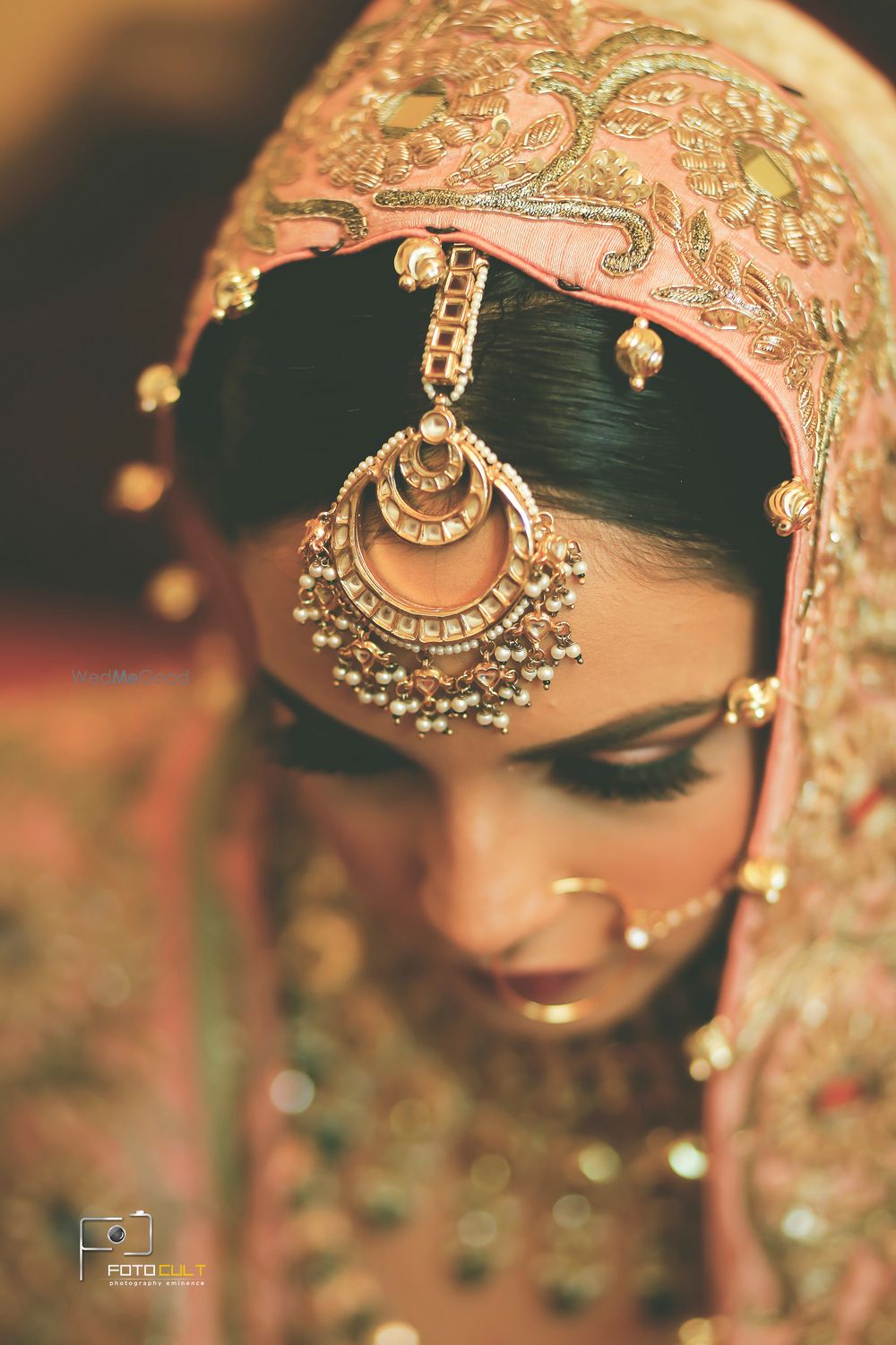 Photo of Rose gold maangtikka with light pink lehenga