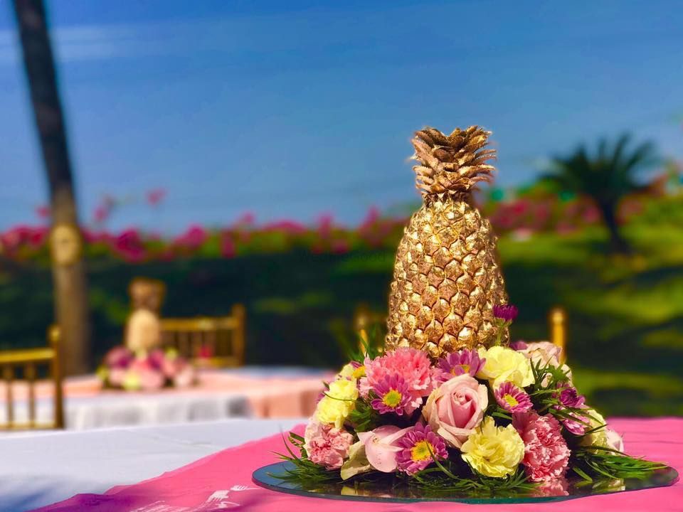 Photo of Golden painted pineapple table setting