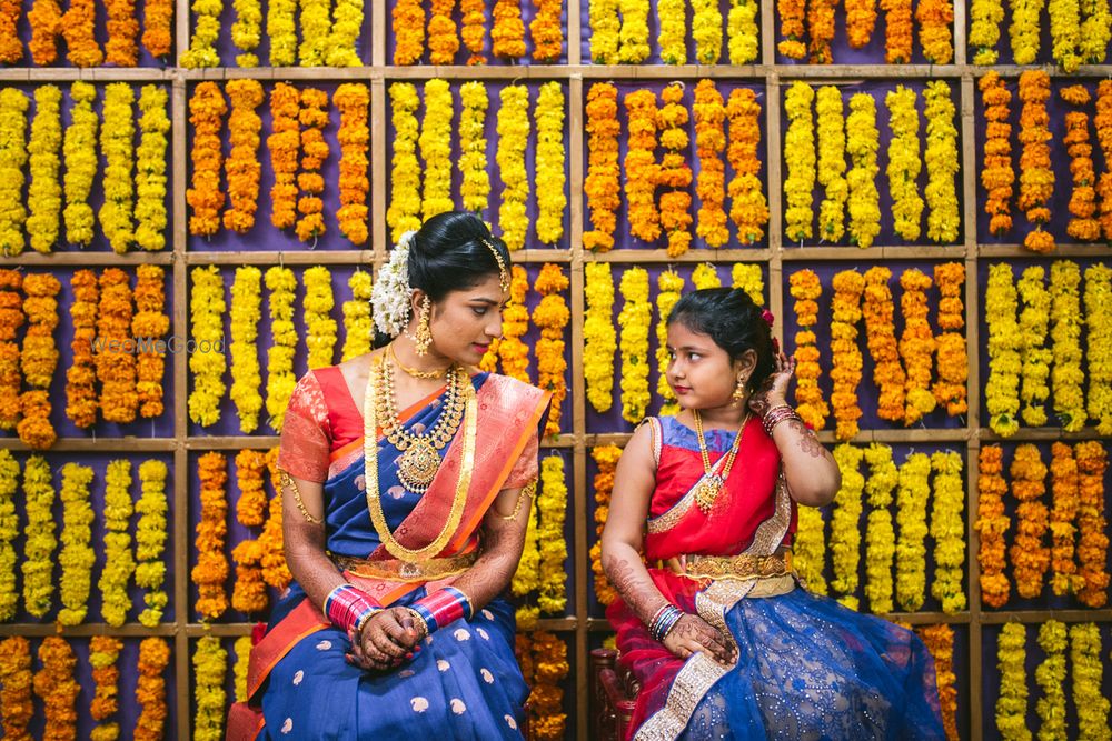 Photo of Genda flower photobooth backdrop