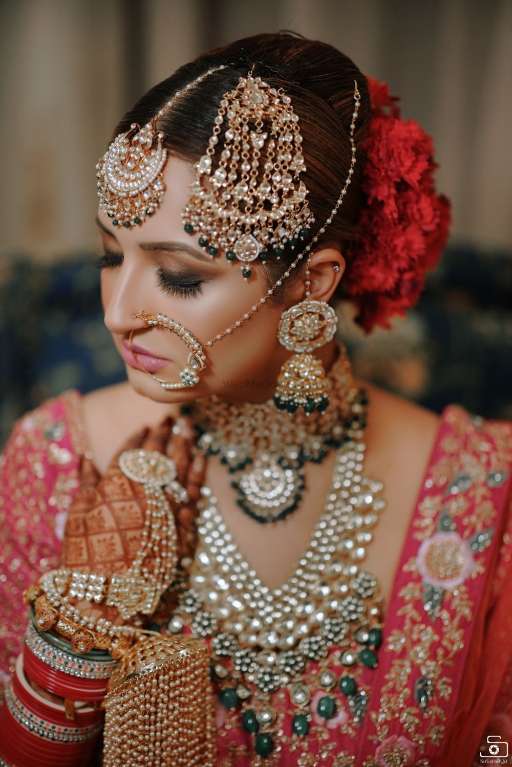 Photo of Bride wearing OTT jewellery on her wedding day.