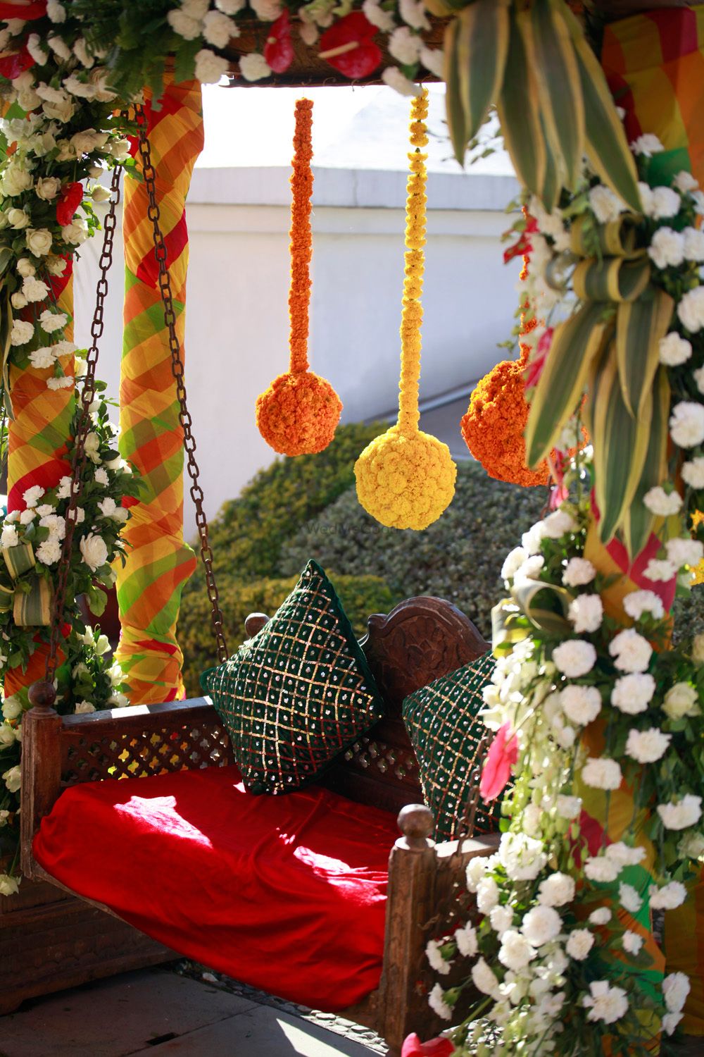 Photo of Floral swing with hanging floral balls for mehendi