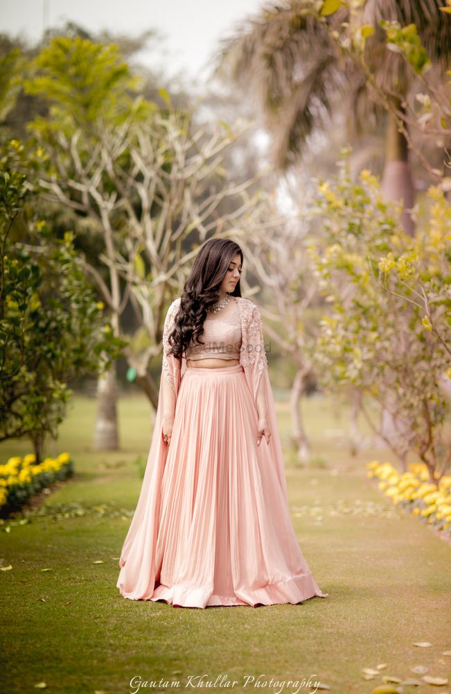 Photo of Light peach lehengas with cape sleeves for engagement