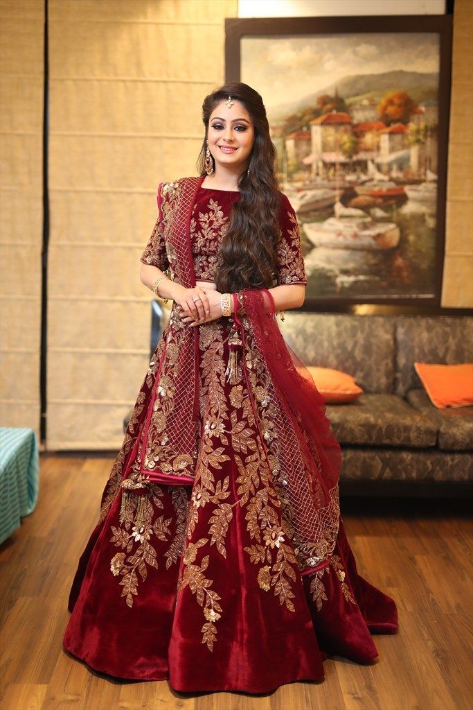 Photo of Maroon lehengas with gold embroidery for reception