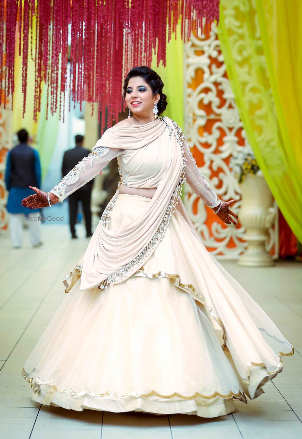 Photo of Off white scalloped edge lehenga with silver motifs