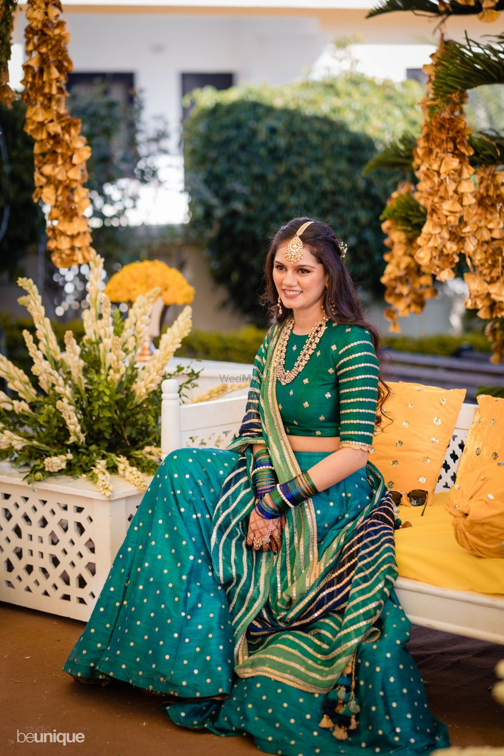 Photo of Bride dressed in a teal lehenga for her pre-wedding festivities