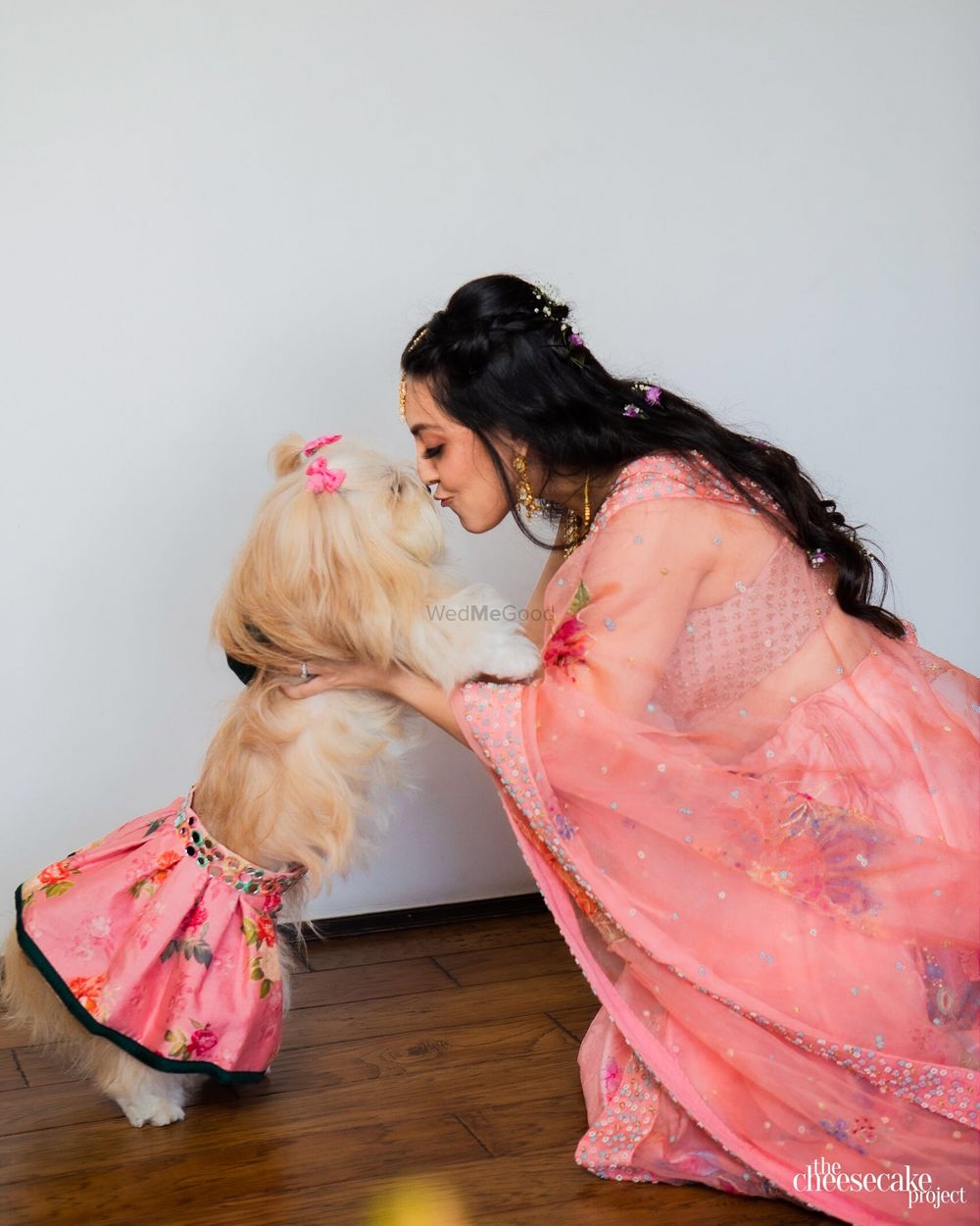 Photo of Bride coordinating with her pet.