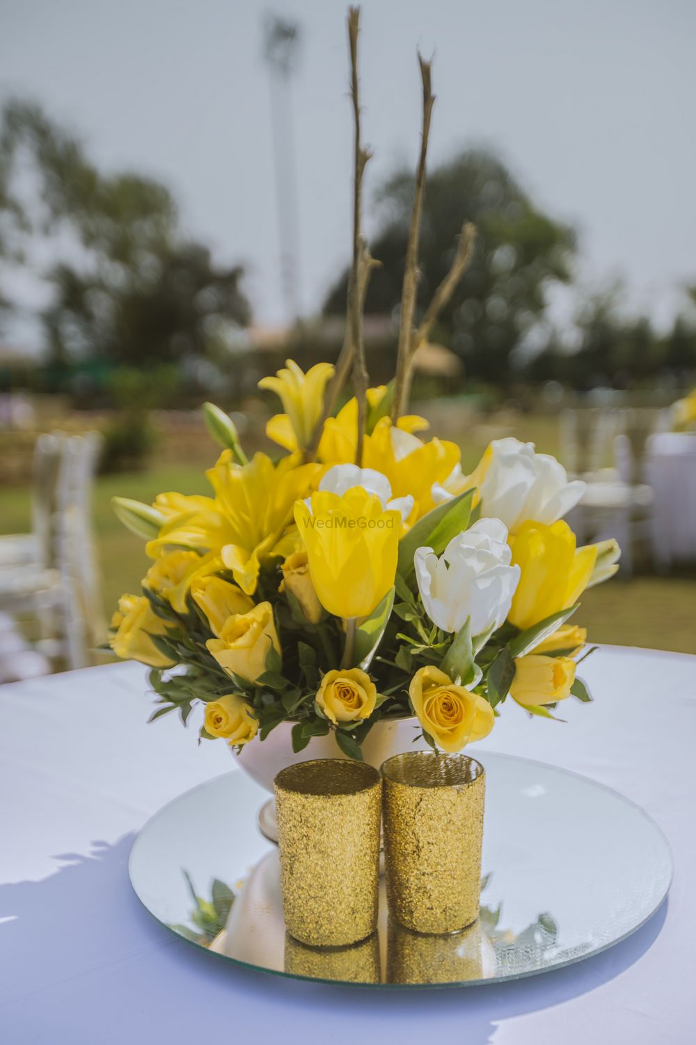 Photo of Yellow and white table centerpiece