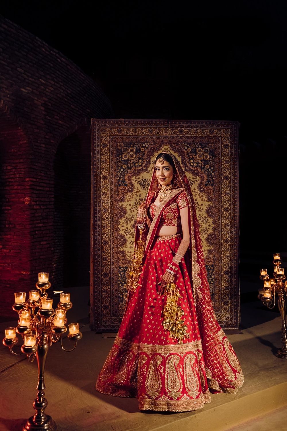 Photo of Bride wearing a red lehenga on her wedding day.