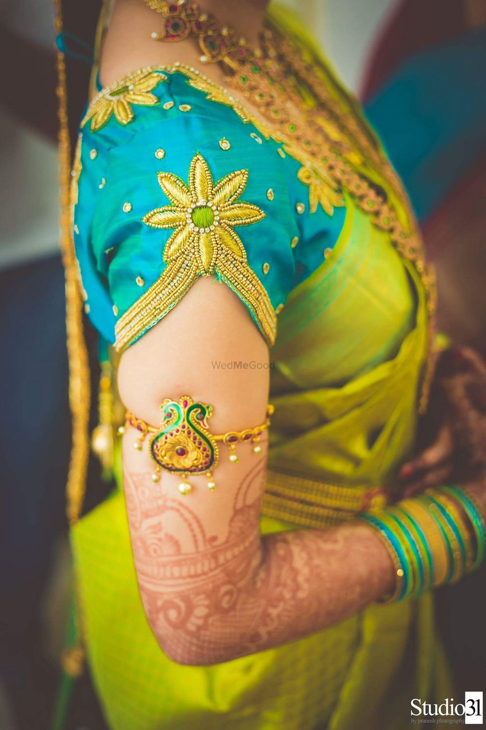 Photo of South Indian bridal blouse with green saree and armlet