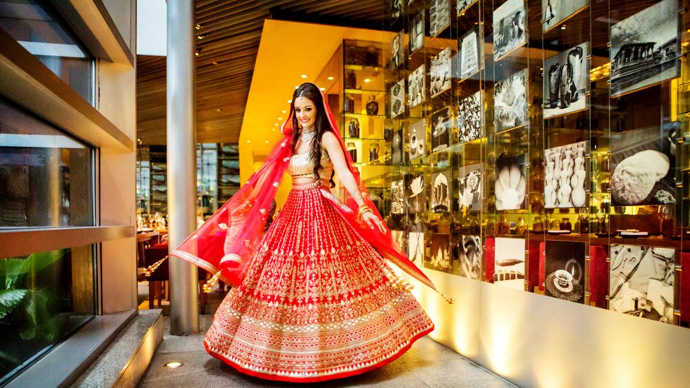 Photo of Red and gold bridal lehenga with gotta patti work