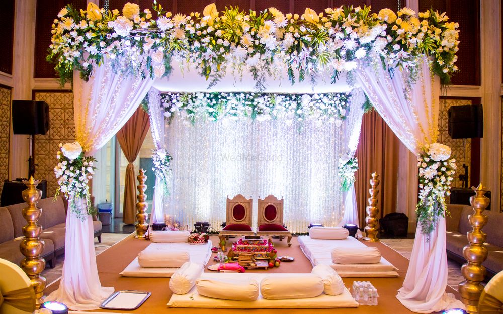 Photo of Fairytale mandap with drapes and dreamy lighting