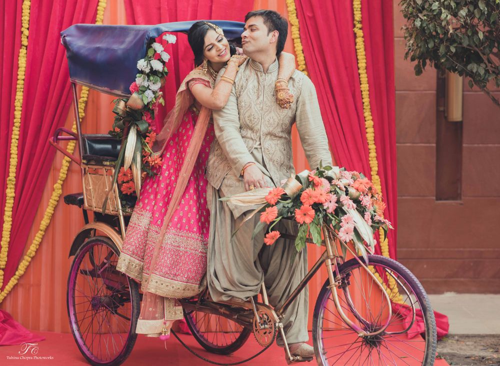 Photo of rickshaw with bride and groom