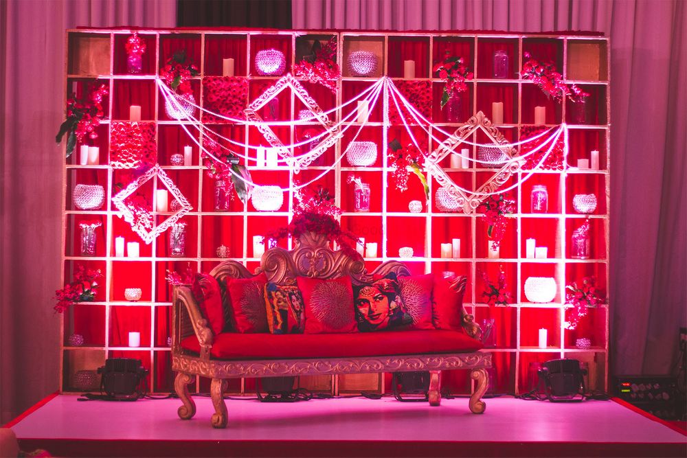 Photo of Bollywood theme sangeet stage decor with sofa