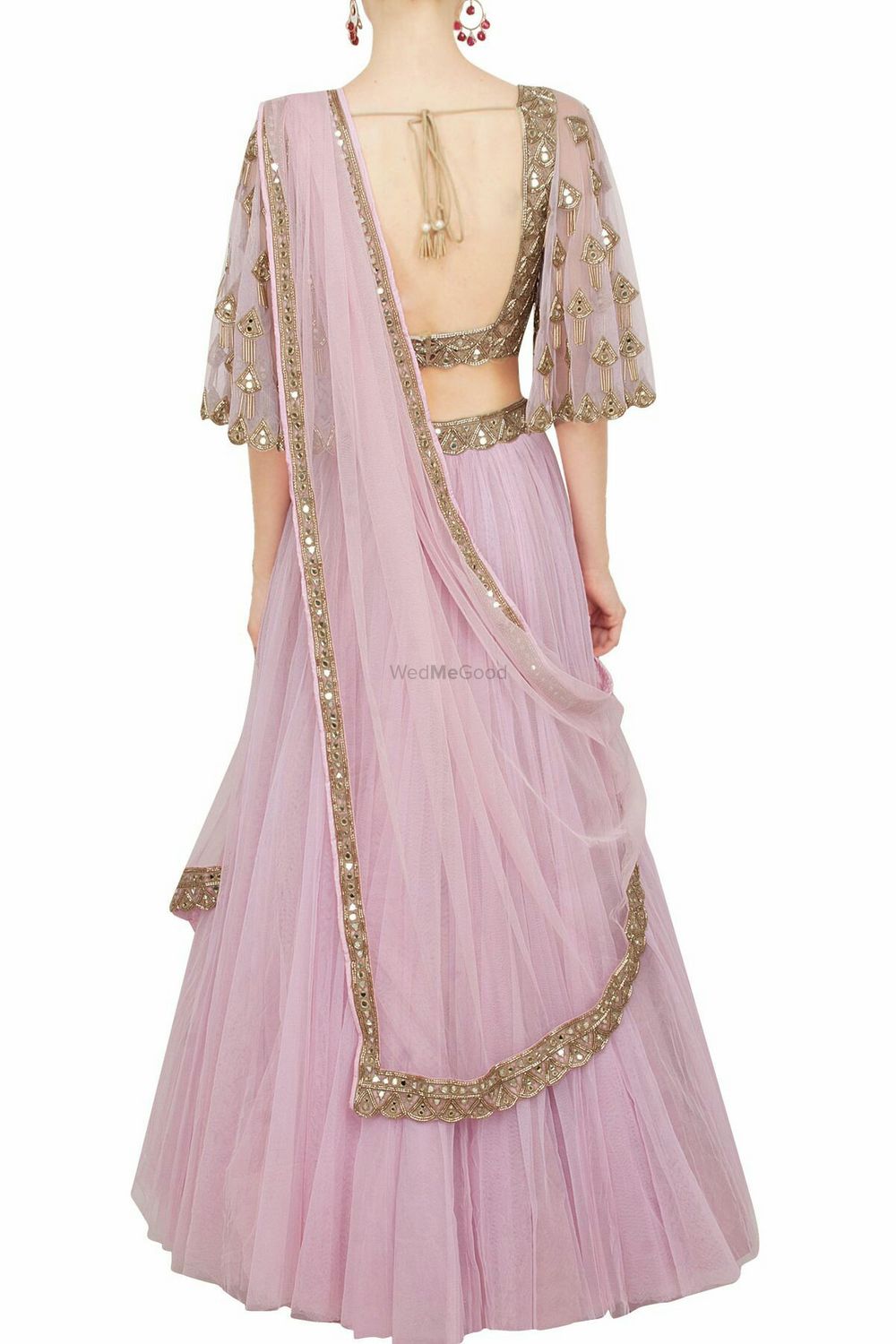 Photo of Onion pink lehenga with dull gold work and cape sleeves