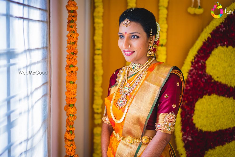 Photo of Gold and orange kanjivaram with contrasting maroon blouse