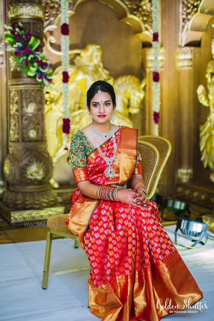 Photo of South Indian bride in red kanjivaram and green blouse