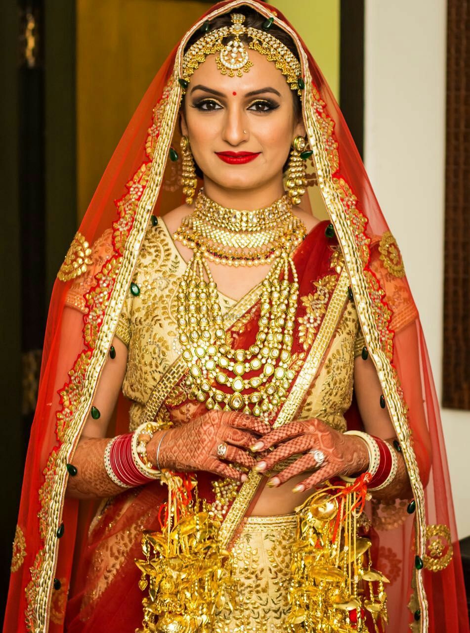 Photo of Akriti Kakkar in Crimson Bridal Lehenga