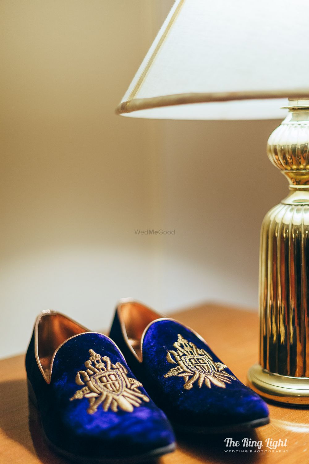 Photo of Blue and gold embroidered shoes for groom