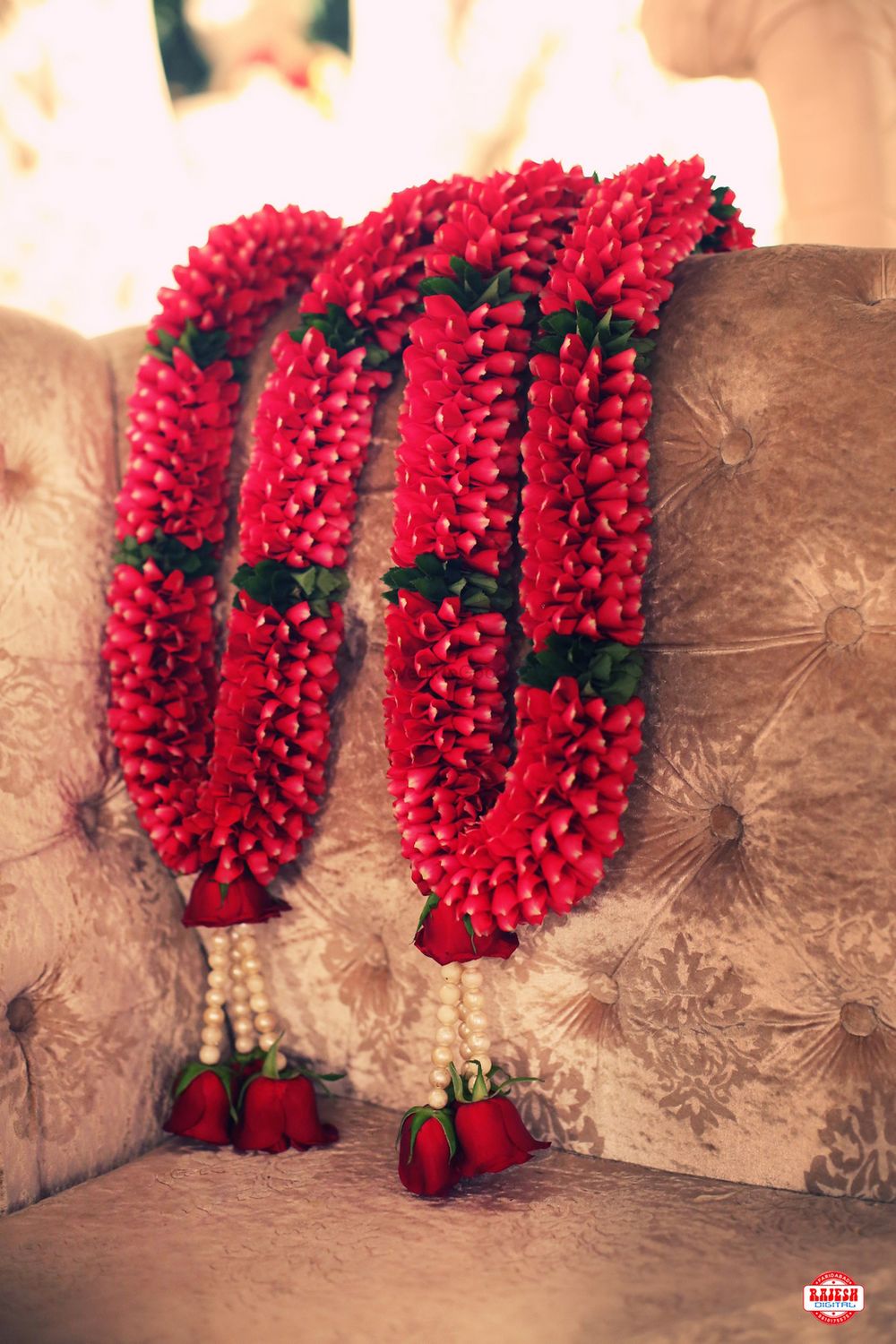 Photo of Red jaimala with hanging pearls and roses
