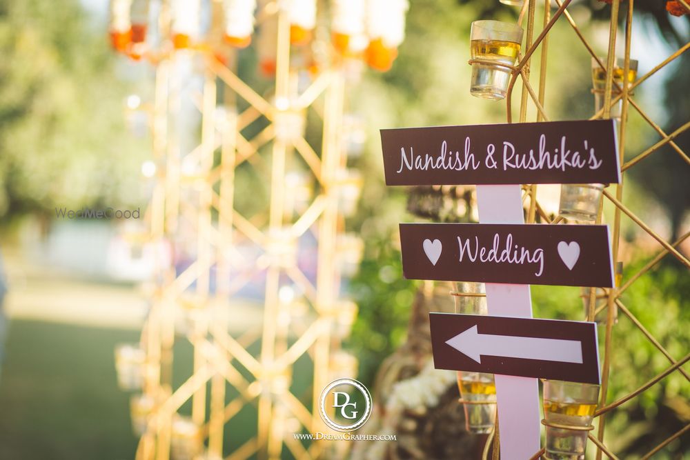 Photo of Wooden direction signboard for wedding