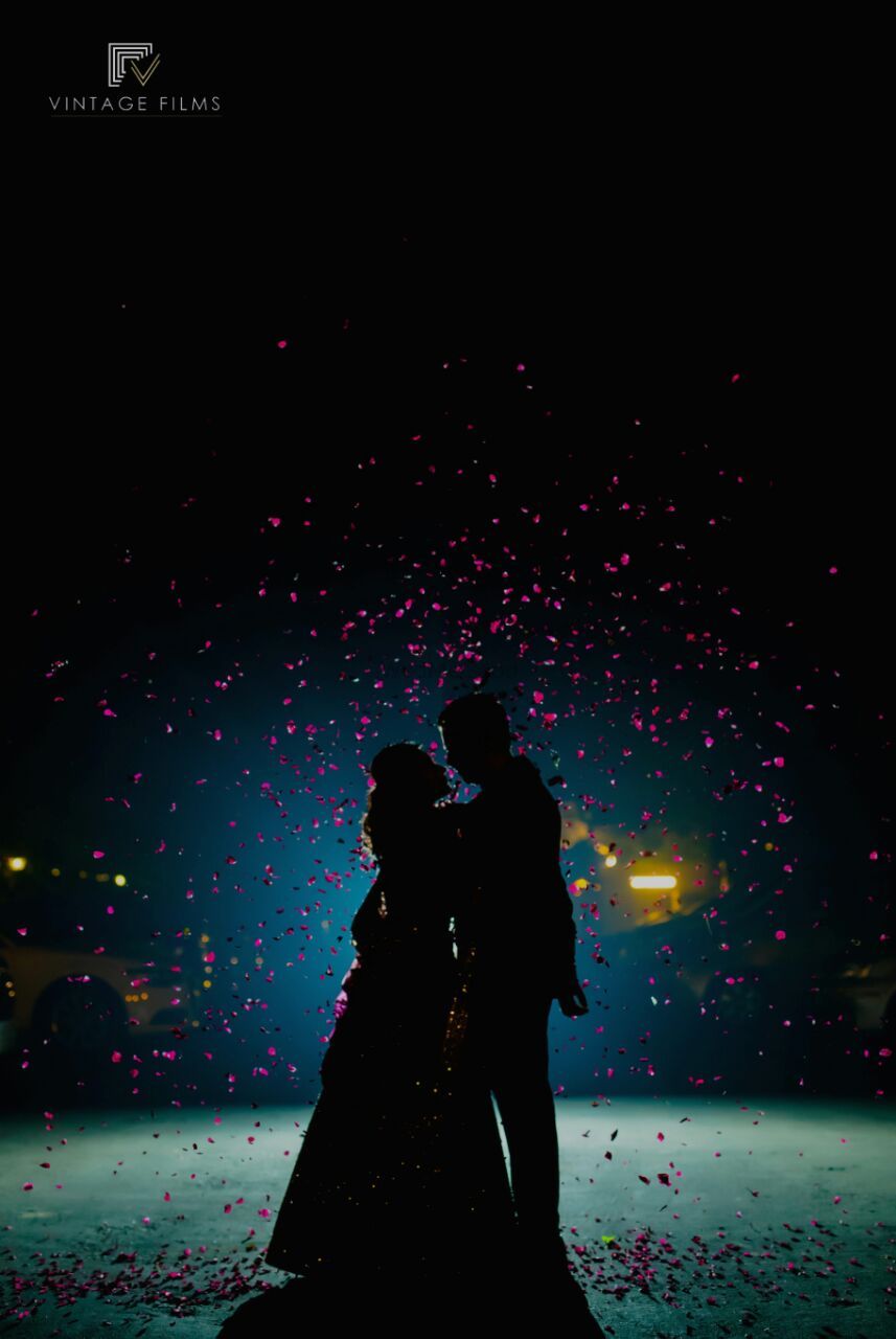 Photo of Romantic couple rose petals shot