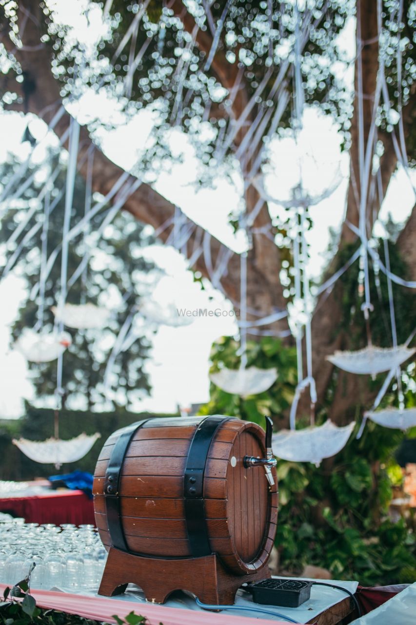 Photo of Food display idea with beer barrel for backyard wedding