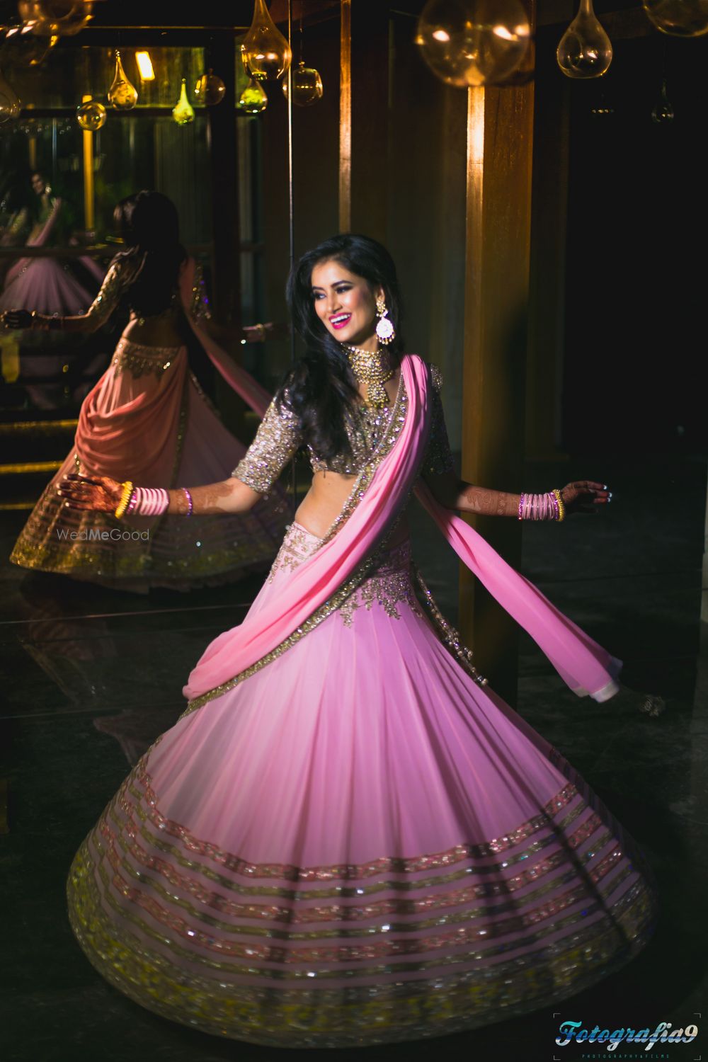 Photo of Twirling bride shot in Mauve lehenga