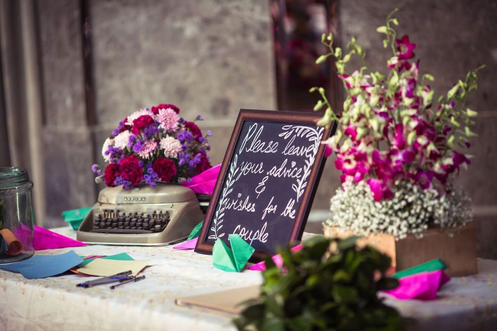 Photo of Table and props for guests to leave messages for the couple