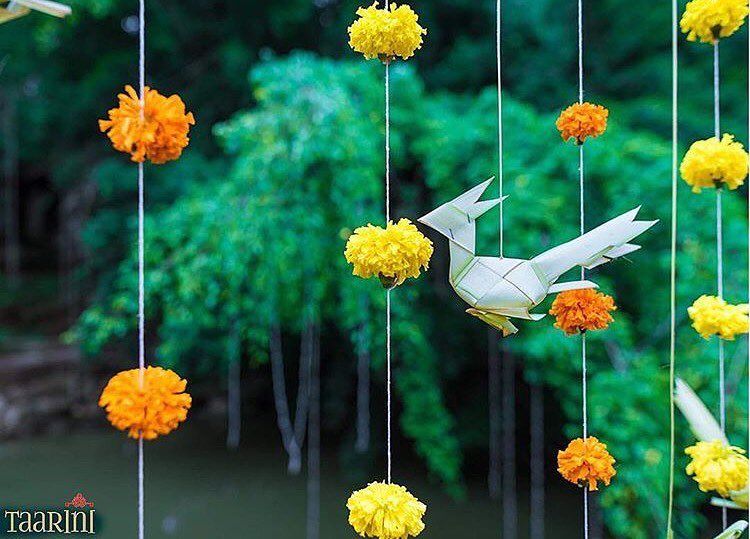 Photo of Hanging genga phool strings and paper decor elements