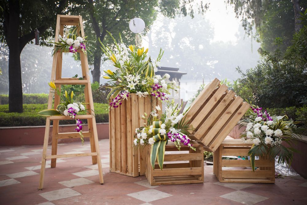 Photo of Backyard wedding decor with rustic setting using wooden crates