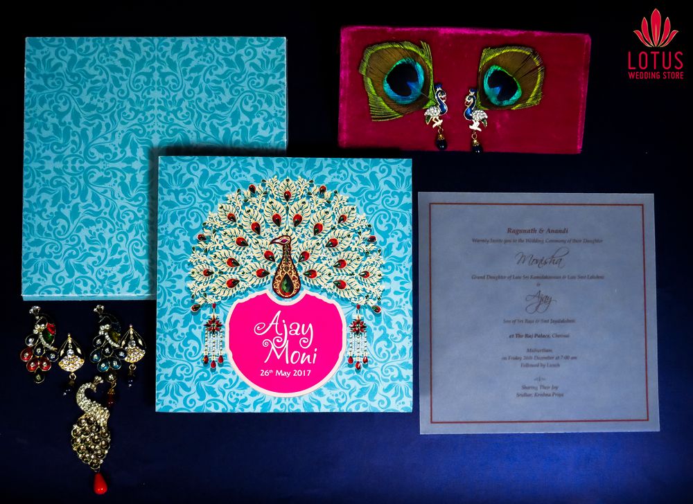 Photo of Turquoise and pink wedding invitation