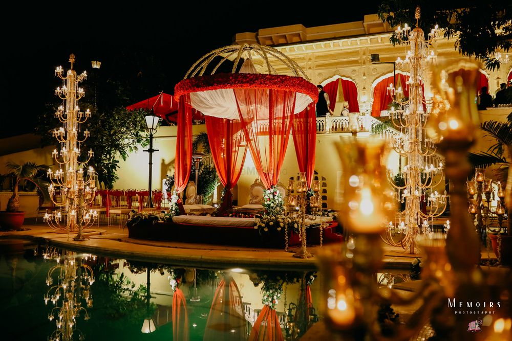 Photo of A glam mandap by the pool.